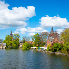 Minnewater castle at the Lake of Love in Bruges, Belgium.