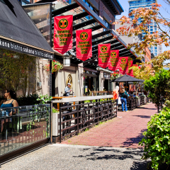 VANCOUVER- June 30, 2014: Restaurants in the trendy Yaletown neighborhood, formerly a warehouse district. Many choices, like the Japanese small plates bistro shown, and the artisan brewery next door. 