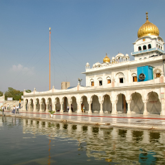 NEW DELHI, INDIA - APRIL 21, 2007: Unidentified people in front of Gurudwara Bangla Sahib in New Delhi, India. Gurdwara Bangla Sahib is most prominent Sikh house of worship in Delhi opened at 1783.