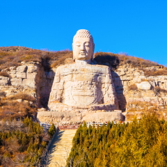 Stone carving Mengshan Buddha. It was built in A.D. 551. The head was rebuilt in After A.D.2000. The Buddha is located Southwest suburbs of Taiyuan, Shanxi, China. 
