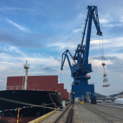 Bulk cargo ship loading goods at the Port of changxing island, north of Dalian city,China. 