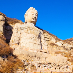Stone carving Mengshan Buddha. It was built in A.D. 551. The head was rebuilt in After A.D.2000. The Buddha is located Southwest suburbs of Taiyuan, Shanxi, China. 