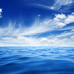 Blue sea water surface on sky