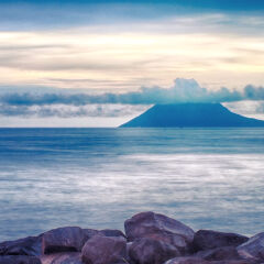 Scenic View Of Sea Against Cloudy Sky At Sunset