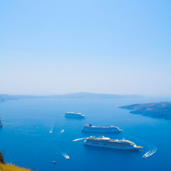 cruise ship near volcano on island of Santorini