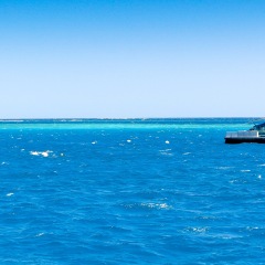 Helicopter on a helipad near the Great Barrier Reef in Queensland, Australia.