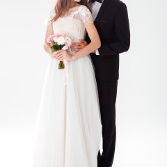 Full-length portrait of newlyweds. isolated white background