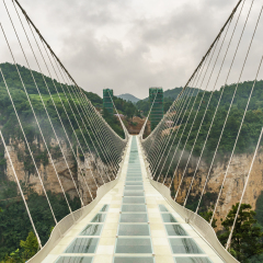 Zhangjiajie grand canyon, Hunan, China - August 4, 2016 : The new glass bridge over the Zhangjiajie grand canyon