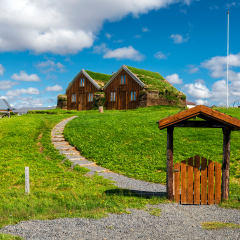 Wooden doorway and walk steps to traditional Icelandic turf houses in Modrudalur farm settlement of Eastern Island
