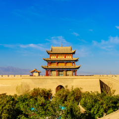 The Rouyuan Tower of the West Barbican inner city wall of the Jiayuguan Fortress, which is the western-most Ming Great Wall Garrison, in the Great Wall of China and a blur view of tourists