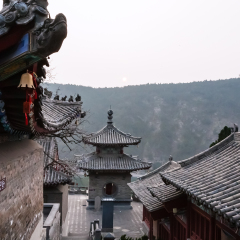 LUOYANG, CHINA - MARCH 20, 2017: courtyard of Temples on East Hill of Chinese Buddhist monument Longmen Grottoes in spring. The complex was inscribed upon the UNESCO World Heritage List in 2000