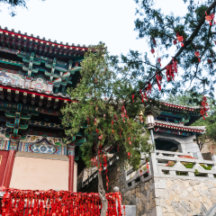 LUOYANG, CHINA - MARCH 20, 2017: edifice of Xiangshan Temple on East Hill of Buddhist monument Longmen Grottoes in spring. The complex was inscribed upon the UNESCO World Heritage List in 2000