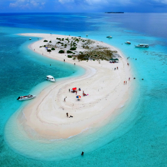 Aerial view of the stunning white sandbank with beautiful sandy beaches of Maldives