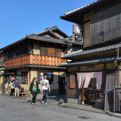 Kyoto, Japan - November 18, 2016: Many tourists are walking along old teashops and cafe in Hanamikoji Street, Kyoto, Japan