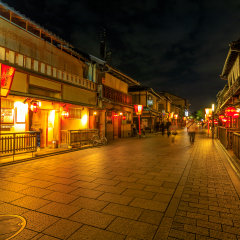 Kyoto, Japan - April 24, 2017: people walking around Gion district by night with typical Kaiseki restaurant.Hanamachi is a Japanese geisha district with okiya or geisha houses and ochaya or teahouses.