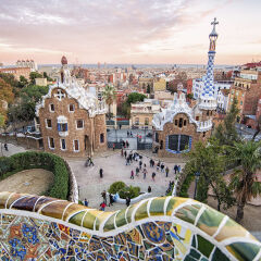 View over Barcelona rooftops from the Parc Guel and landmarks of Gaudi architecture.
