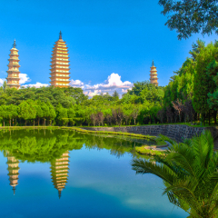 Reflections of three ancient pagodas near Dali, Yunnan Province, China