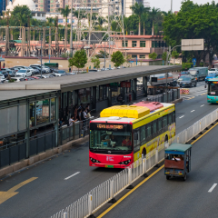 Guangzhou, China - October 9, 2018 : Local Guangzhou city buses parking and coming at bus stop. Guangzhou transportation.