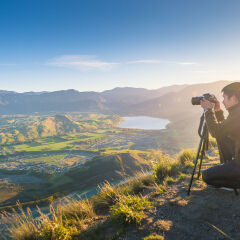 Young travler taking photo at queen town  in new zealand