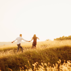 Happy young lovely couple having fun uotdoor at sunset 