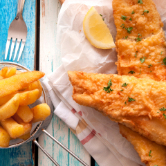 Close up battered fish and chips with mayonnaise sauce
