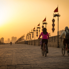 XIAN, CHINA - MARCH 13 2016: People ride at City Wall of Xi'an in the evening. March 13, 2016 a famous Historic Sites in Xian, China.