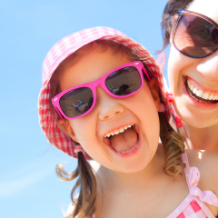 little girl and her mother have  a good time at the seaside resort