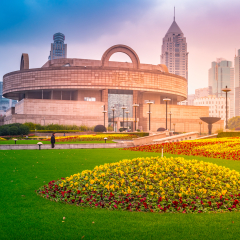 Shanghai downtown at day time, with Shanghai Museum background. China.