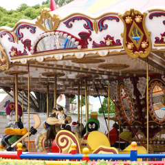 Gold Coast, Australia - April 18, 2018 : A photo of amusement attraction merry-go-round in the Movie World with selective focus on the Wile E. Coyote, a character from the Road Runner cartoon series.