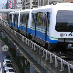 Taipei, Taiwan, Aug, 28, 2011: Taipei Metro Wenhu  Line (Known as The Muzha Line Before Oct, 8, 2009). The Train Runs on Elevated Rails While Other Cars Jammed on The Roads.