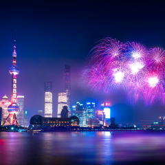 china nation day celebrate night in Shanghai city with celebration freworks and light from modern city skyscrapers and reflection of beautiful ligth in Huangpu river, Shanghai, China