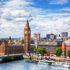 Big Ben, Westminster Bridge on River Thames in London, the UK. English symbol. Lovely puffy clouds, sunny day