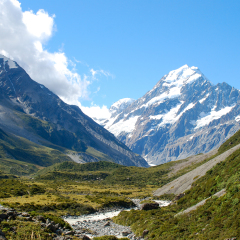 The majestic view of Mount Cook, New Zealand's highest mountain, approaching on the hiking trail through Hooker Valley.