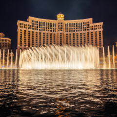 Las Vegas, Nevada, USA - December 29, 2017 : The Fountains of Bellagio at night. This feature performs choreography with water, music and light in front of the Bellagio hotel and casino.