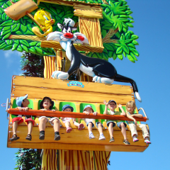 GOLD COAST, AUSTRALIA - APRIL 16 2008: Children riding Sylvester’s Pounce’n’Bounce in Movie World Australia.The park opened in 1991 and contains various movie-themed rides and attractions