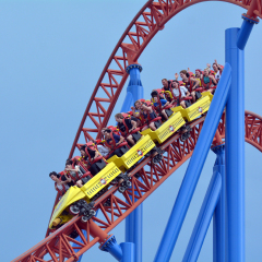 GOLD COAST, AUS -  NOV 06 2014:Visitors ride on Superman Escape in Movie World Gold Coast Queensland Australia.It's an Accelerator Coaster that accelerates from 0 to 100 Km per hour (62 mph) in 2 sec.