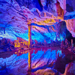 The Reed Flute Cave, natural limestone cave with multicolored lighting in Guilin, Guangxi, China.