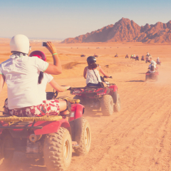 Motorcycle safari in sand desert Egypt. People riding travel. Beautiful holiday landscape. Extreme hobby games.  Transport panorama. Amazing desert Sharm. Adventure Africa. Fun game.