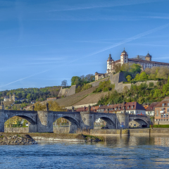 View of Marienberg Fortress with Alte Mainbrucke from main river, Wurzburg, Germany
