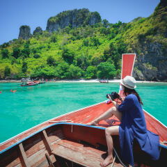 Happy female traveling on boat