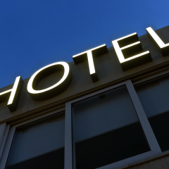 Hotel glowing sign at night.