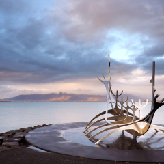 Sun Voyager monument, clouds, landmark of Reykjavik city.