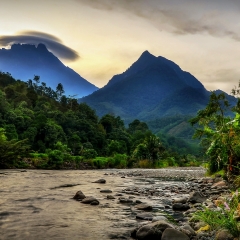 The Village Of Tambatuon, Kota Belud, Borneo, Sabah, Malaysia with Kinabalu Mountain as background and amazing rare cloud formation on the top of it.
