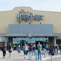 London, England - 26 July 2016 : Tourists taking picture in front of the Warner Brothers Studio tour, The making of Harry Potter at Leavesden Studio in London.