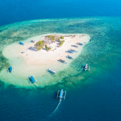 Aerial view of exotic Gili Kedis island with turquoise water in Lombok, Indonesia