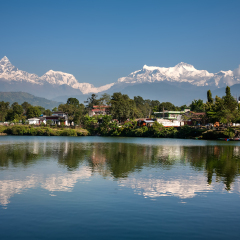 View at Annapurna mountain range and its reflection in Phewa lake in Pokhara, Nepal